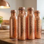 Pure copper water bottle on a wooden table with healthy lifestyle elements
